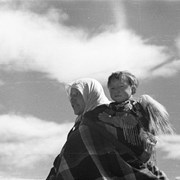 Cover image of Unknown woman carrying child on her back